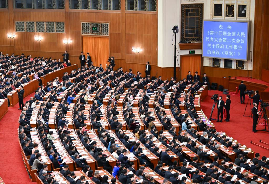 3月11日，第十四屆全國人民代表大會第二次會議在北京人民大會堂舉行閉幕會。新華社記者 牟宇 攝